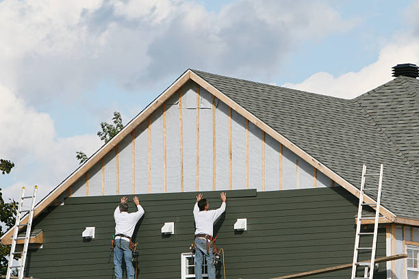 Professional Siding Installation technician working in Wellesley Hills, MA